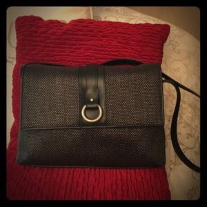 Black textured bag with red interior